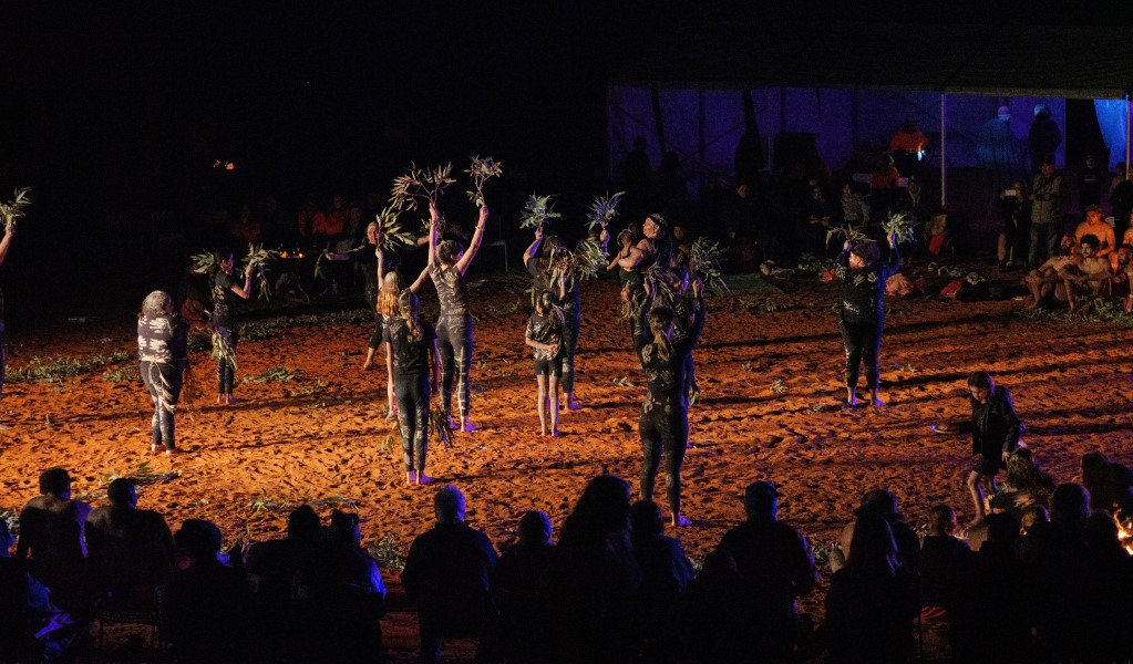 Traditional Aboriginal dance group performing in front of a crowd of people on Paka Marnti dance ground at Mutawintji cultural festival. Photo: Otis Filley/DCCEEW &copy; DCCEEW