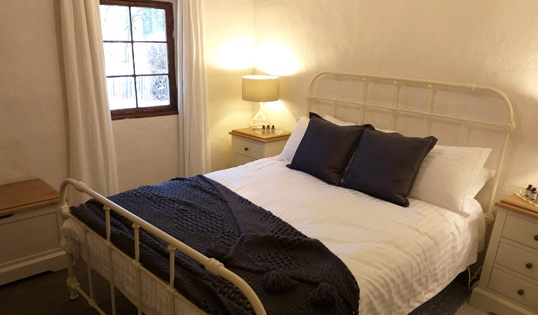 Bedroom with queen bed in Hill End Pines Cottage, Hill End Historic Site. Photo: Brett Kearins/DPIE