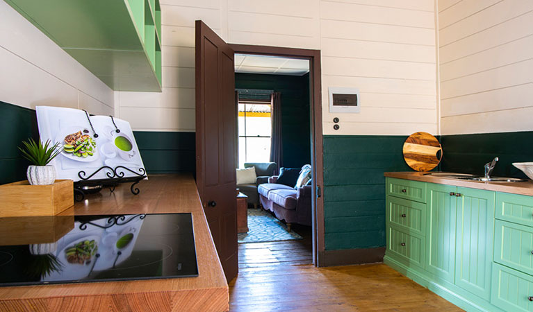 The kitchen with a view to the lounge room in Sydney Hotel Cottage, Hill End Historic Site. Photo: Steve Garland &copy; DPIE