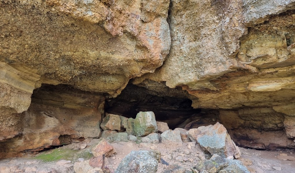 A cave in the sandstone walls along Range View track in Towarri National Park. Photo: Scott Monro &copy; DCCEEW