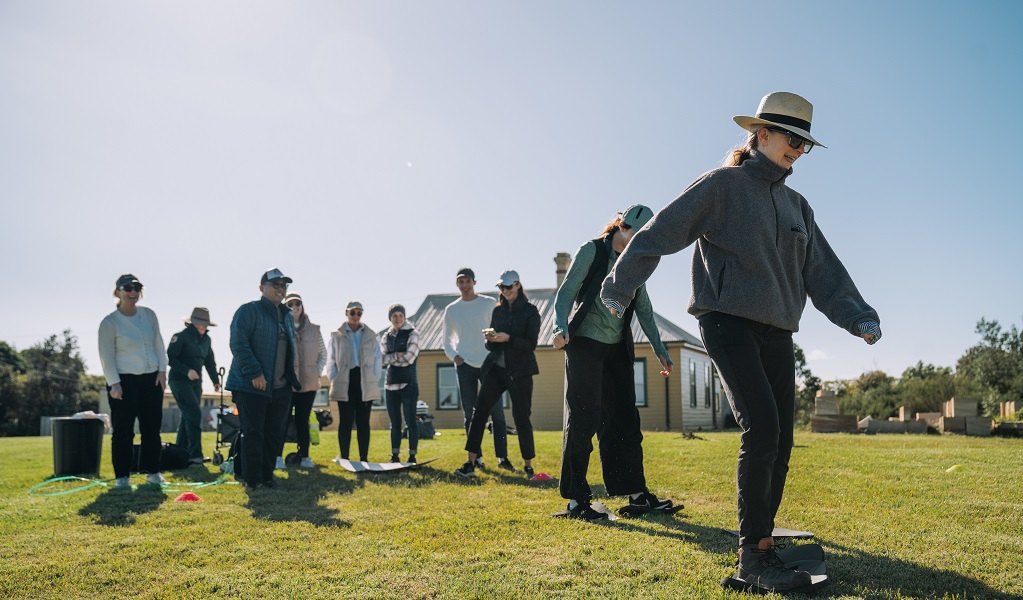 Volunteers take part in a team-building game at Middle Head, Sydney Harbour National Park. Credit: Remy Brand/DCCEEW &copy; the photographer
